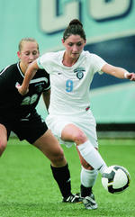 Sophie Rieser ’10 controls the ball for the Lions.